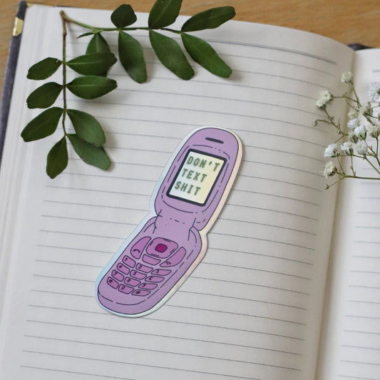 Puhelinan simpukkapuhelin-tarra tekstillä "Don't text shit"